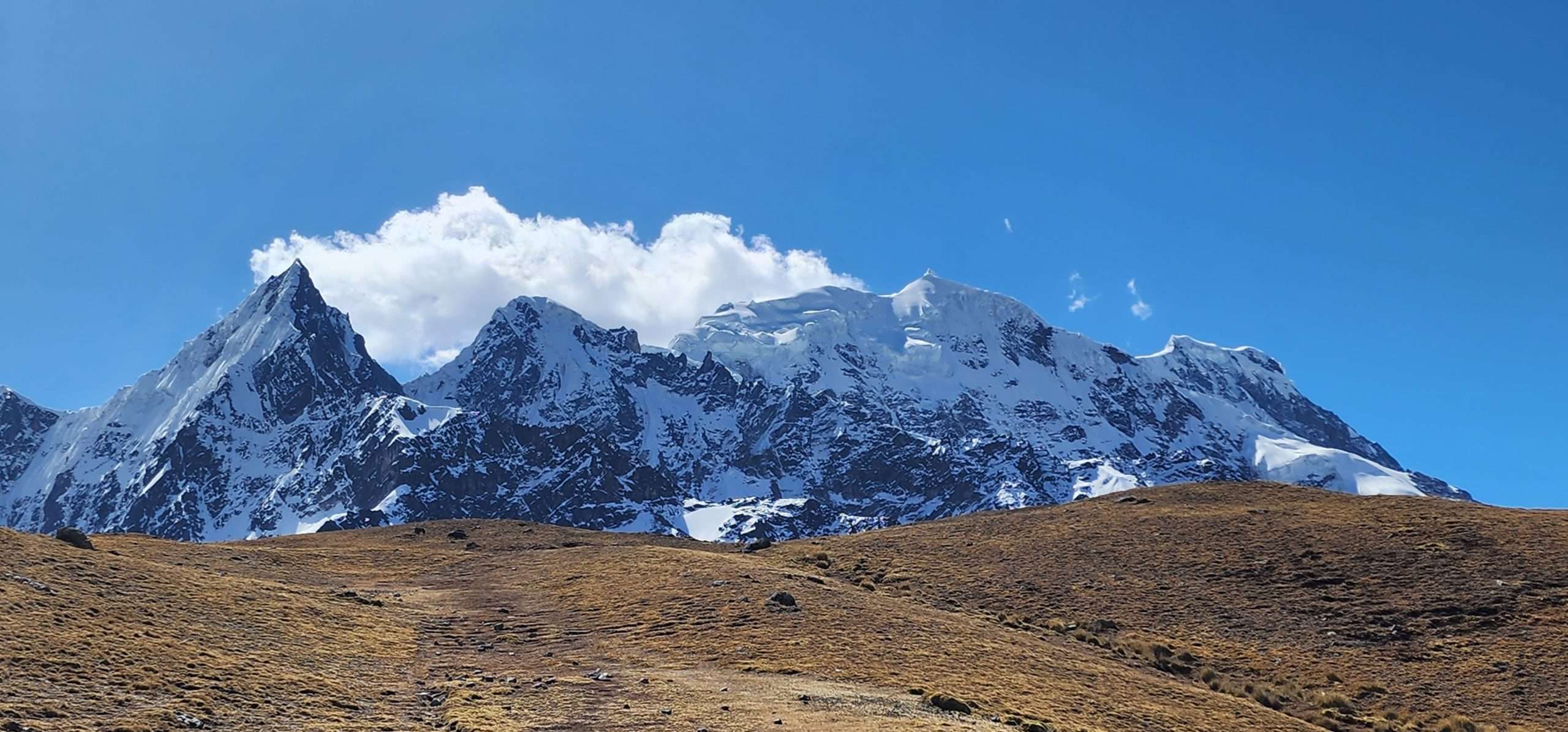 Ausangate Trek 6 Days - snow-capped Ausangate mountain peak with glacier views on the Rainbow Mountain circuit trek in Peru
