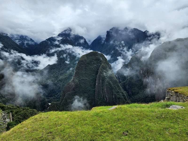 Huayna Picchu peak surrounded by clouds at Machu Picchu