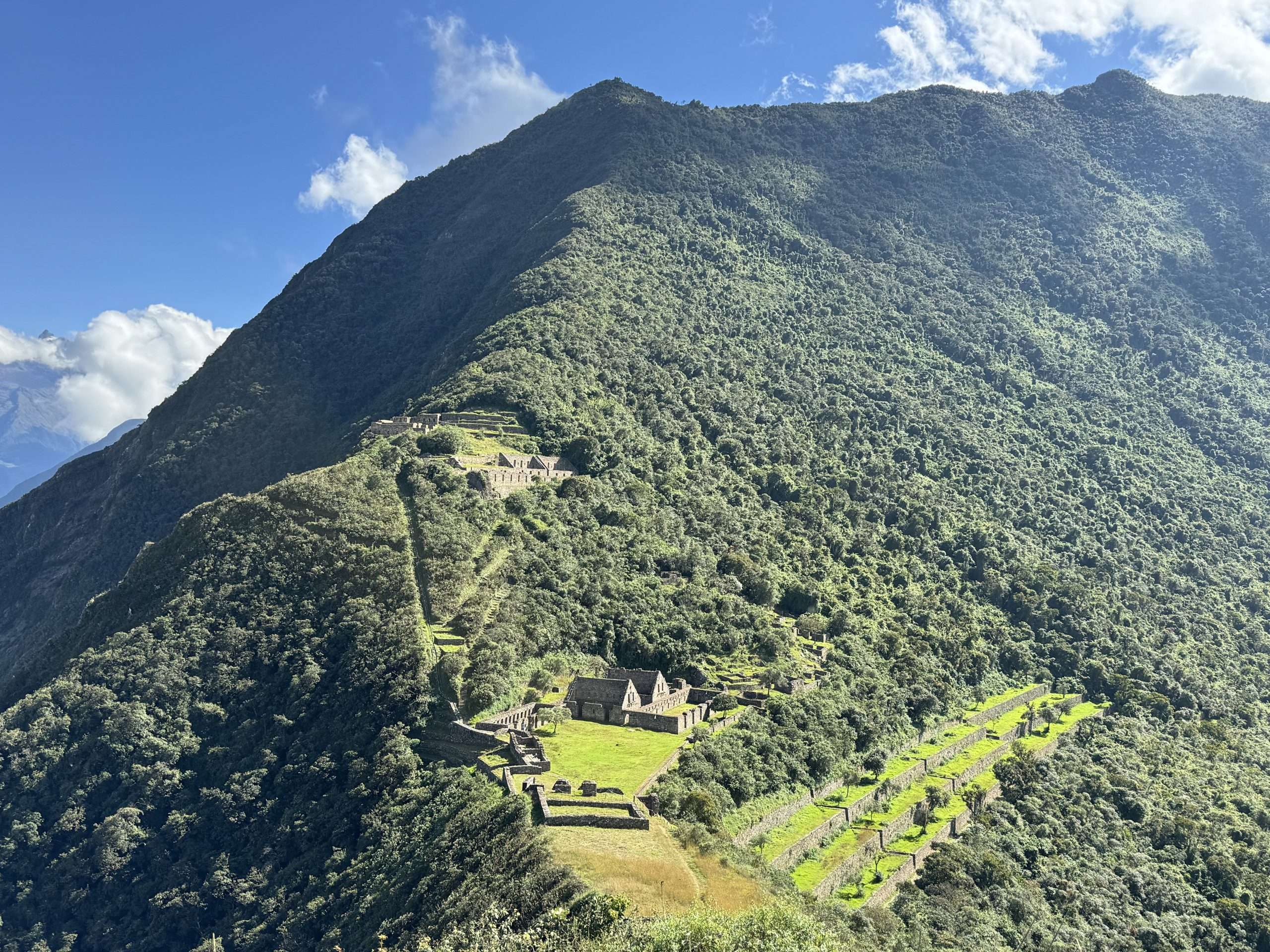 Choquequirao Trek 4 Days - ancient Inca citadel ruins perched on a mountain ridge in the Andes Peru