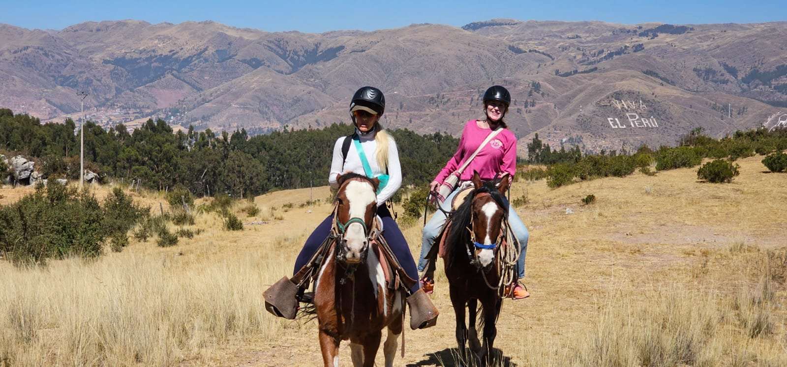 Horseback rider on arid mountain landscape near Cusco