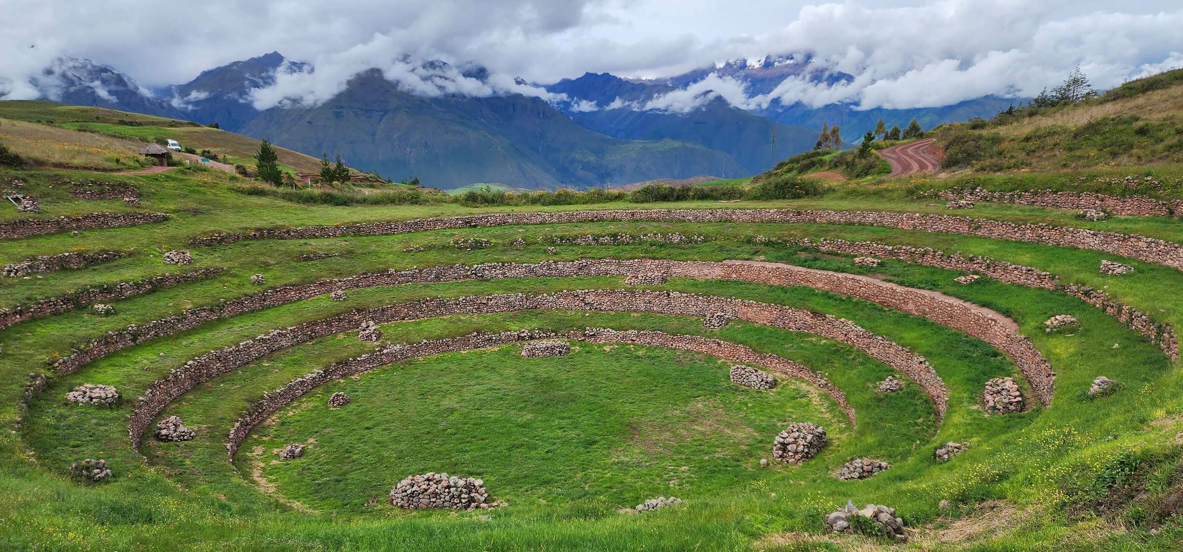Moray circular agricultural terraces with snow-capped Andes mountains in background